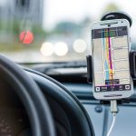 white android smartphone inside vehicle