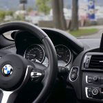 person driving bmw car