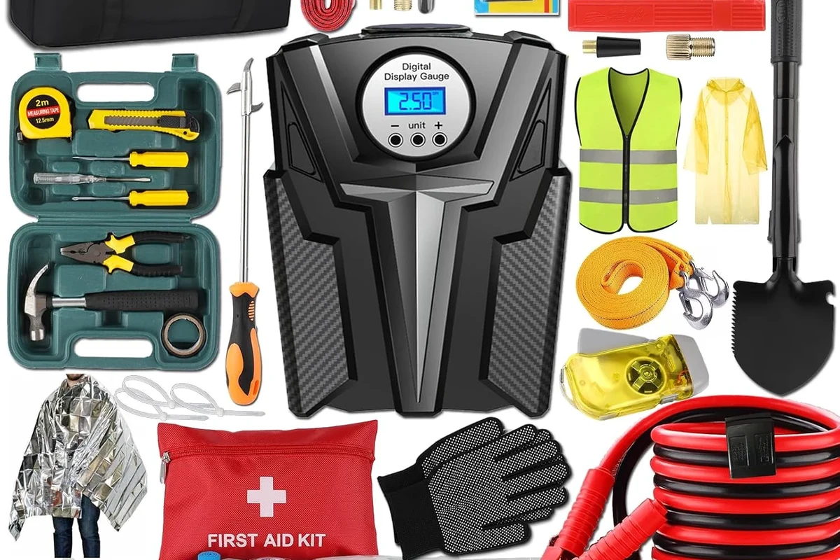 Portable jump starter beside a rental car trunk at an airport pickup lot